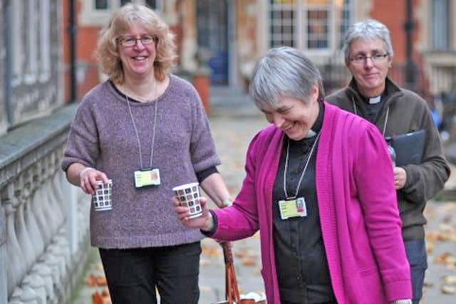 Female Church of England clergy walk into the venue of the three-day