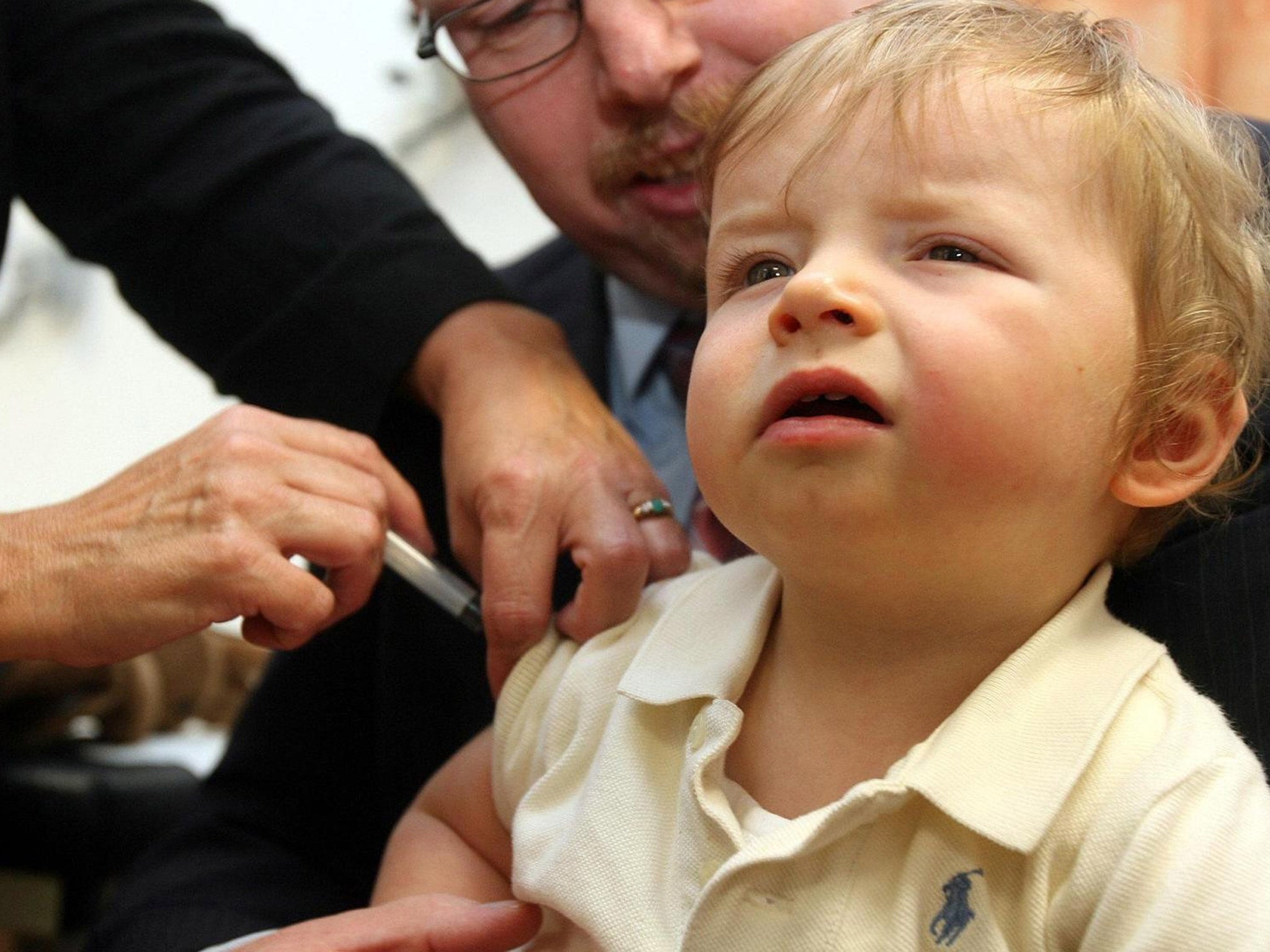 A vaccination is administered to a young child