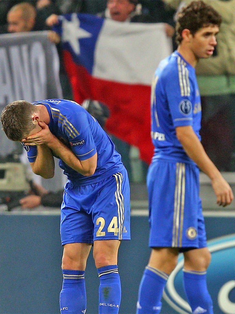 Chelsea's Gary Cahill holds his hands to his head after defeat to Juventus