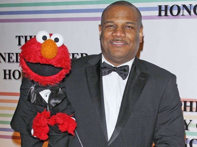 Kevin Clash poses with Elmo