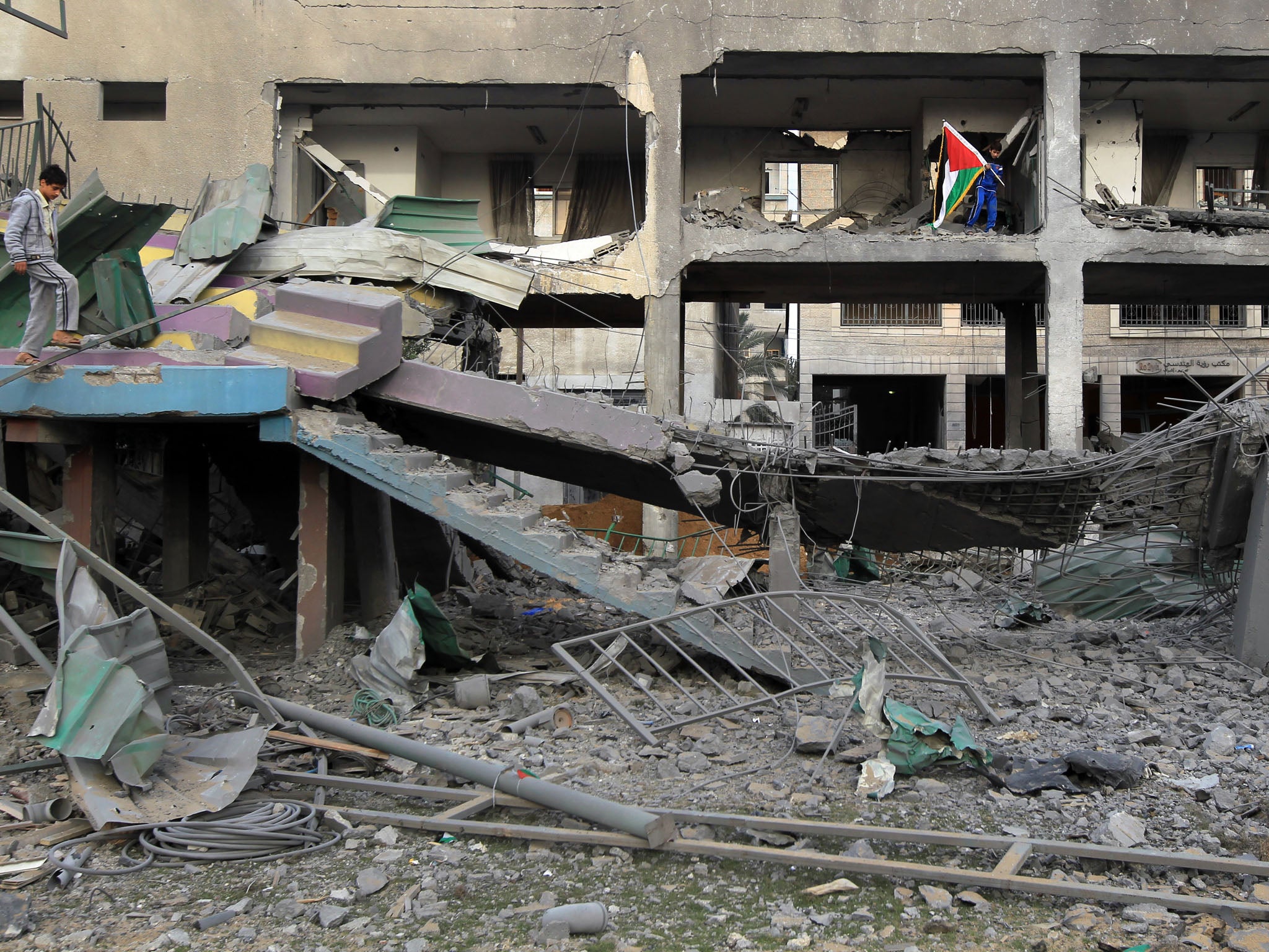 Boys inspect the rubble in Gaza City