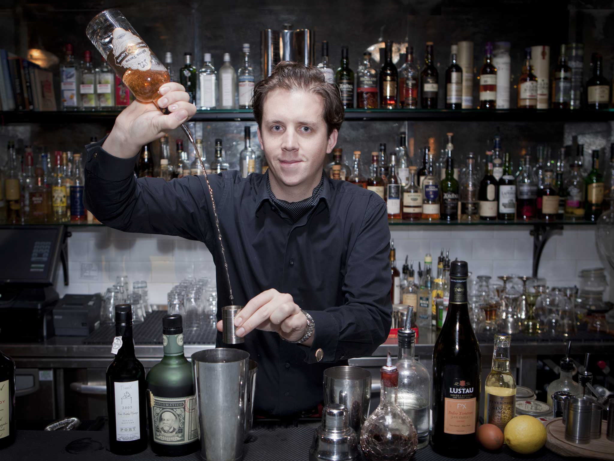 Give it a shot: Lee Potter Cavanagh adds apricot brandy to the mix in preparing a Silent Night at Mark's Bar in Soho