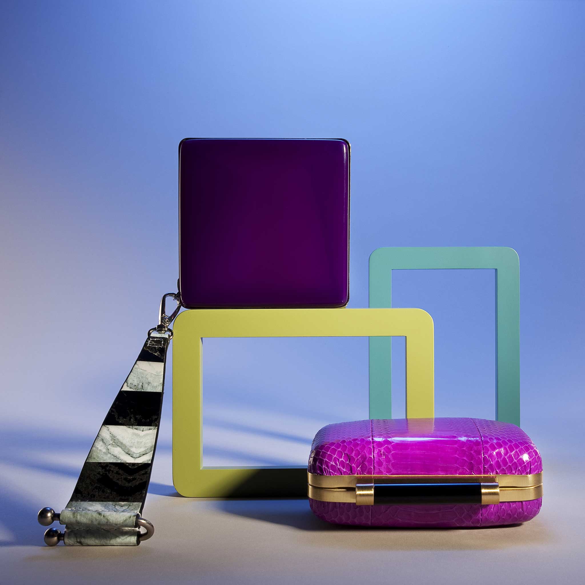 Square wristlet clutch by Kenzo, £230; pink clutch by DVF, £300, both from Selfridges; frames, from £5, John Lewis