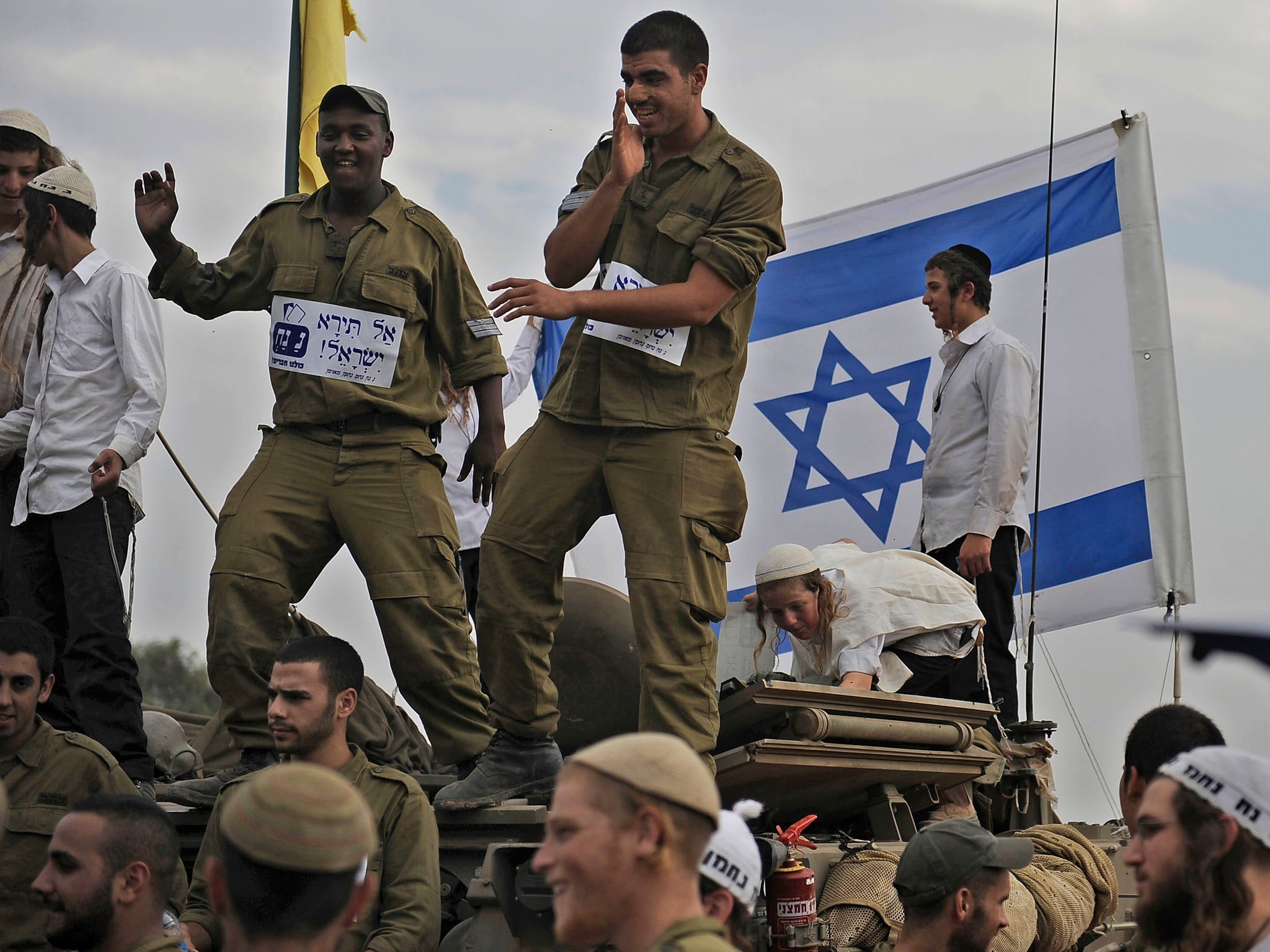 Israeli soldiers in cheerful mood before leaving a deployment area near the Gaza Strip