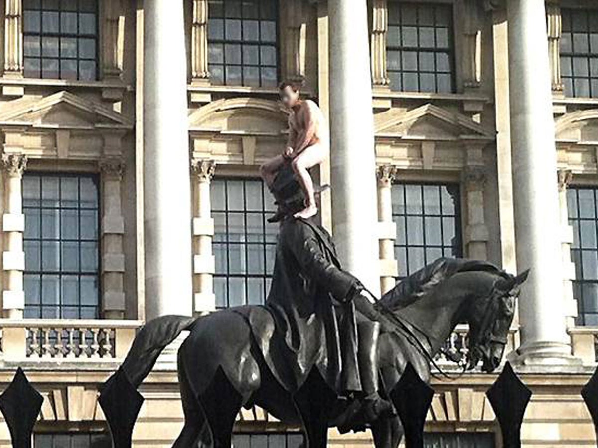 Section of Whitehall closed off as naked man straddled statue | The  Independent | The Independent