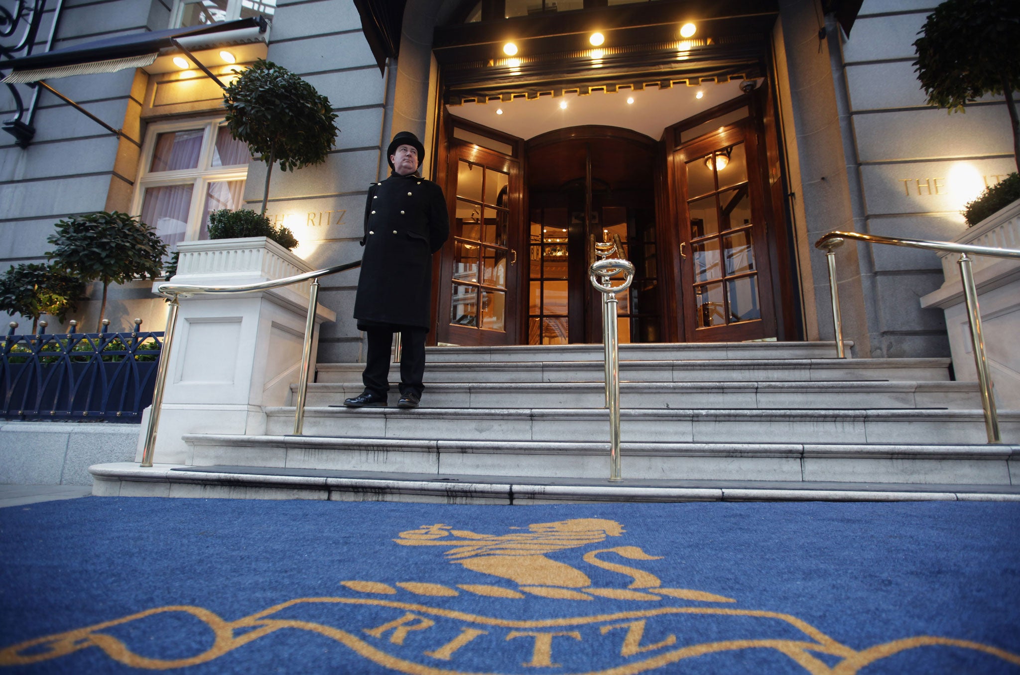 A doorman stands at the entrance to The Ritz Hotel on February 21, 2011 in London, England.