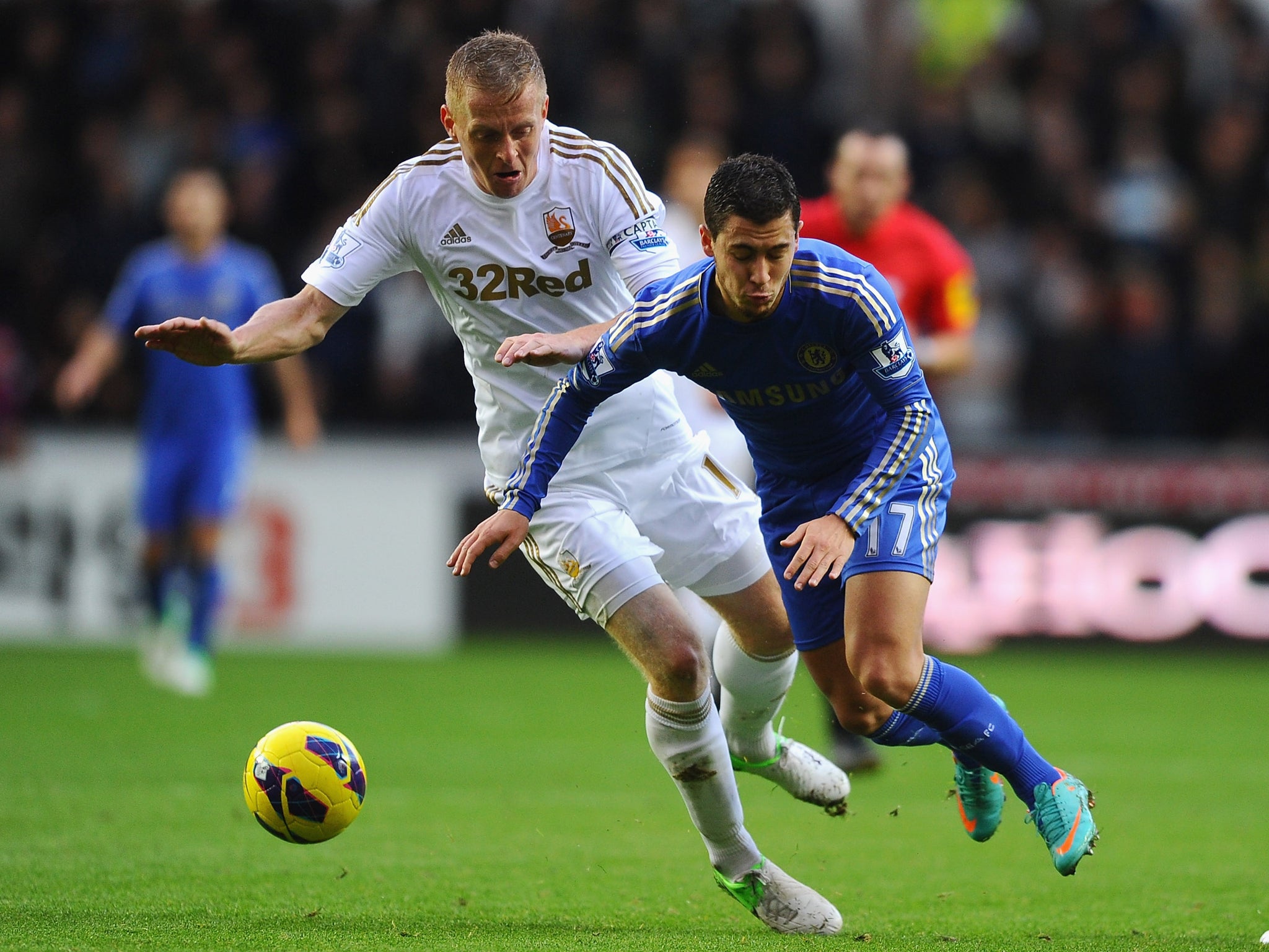 Garry Monk tackles Eden Hazard, of Chelsea, in the Premier League this month