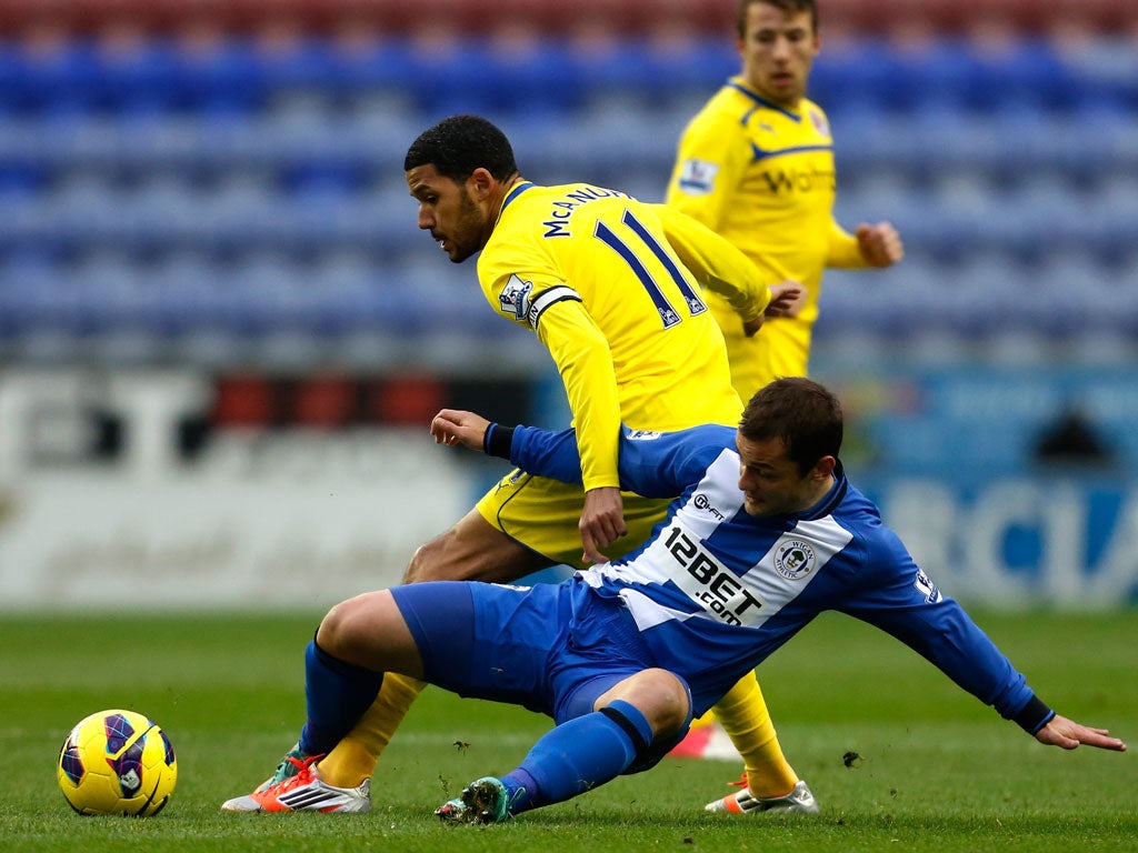 Shaun Maloney (R) of Wigan in action with Jobi McAnuff of Reading