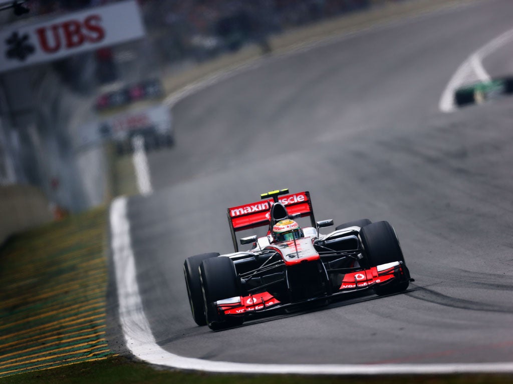 Lewis Hamilton of Great Britain and McLaren drives on his way to finishing first during qualifying for the Brazilian Formula One Grand Prix