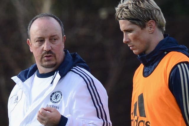 Helping hand: New manager Rafa Benitez gets straight down to work with Fernando Torres on the Chelsea training ground