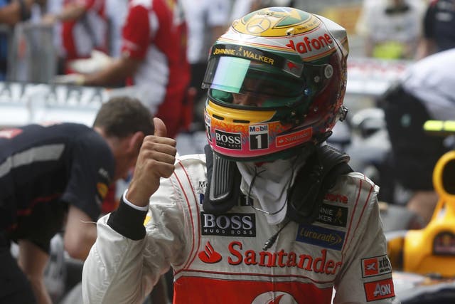 Thumbs up: Lewis Hamilton celebrates his pole position in Säo Paulo