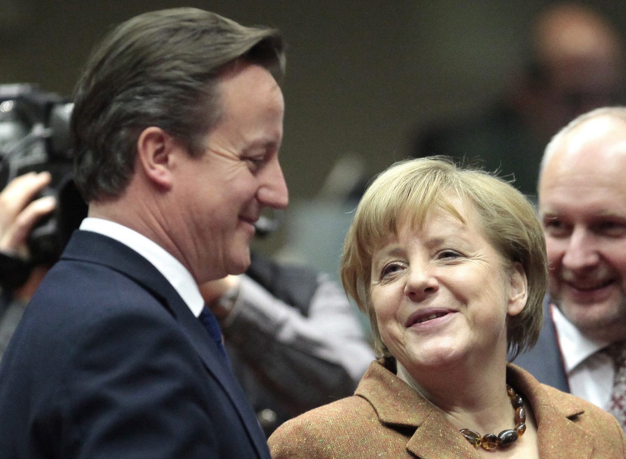 The eyes have it: David Cameron and Angela Merkel at the EU summit in Brussels last week