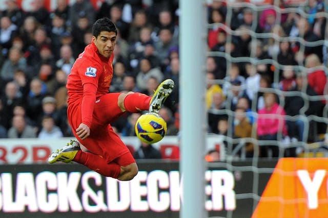 Liverpool's Uruguayan forward Luis Suarez controls the ball