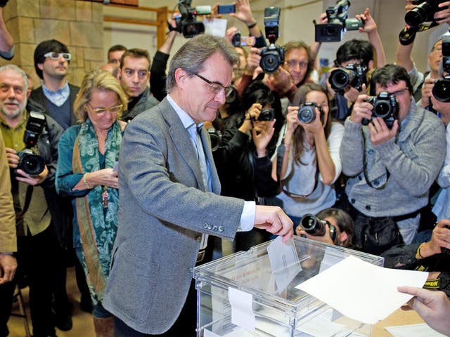 President of Catalonia and of the Pro-Independent Catalan Convergence and Unity party (CIU) Artur Mas, casts his ballot for regional elections held in Catalunyaon 
