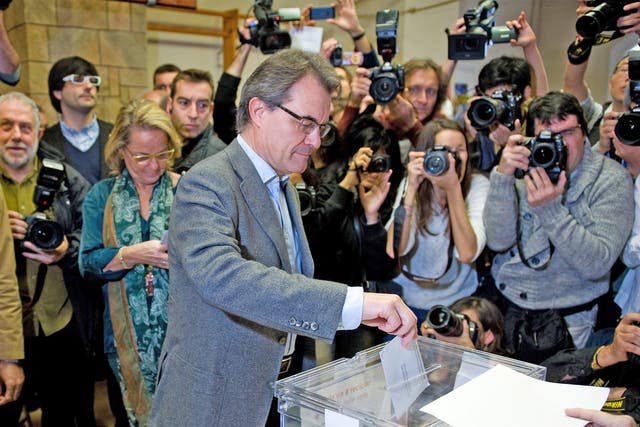 President of Catalonia and of the Pro-Independent Catalan Convergence and Unity party (CIU) Artur Mas, casts his ballot for regional elections held in Catalunyaon 