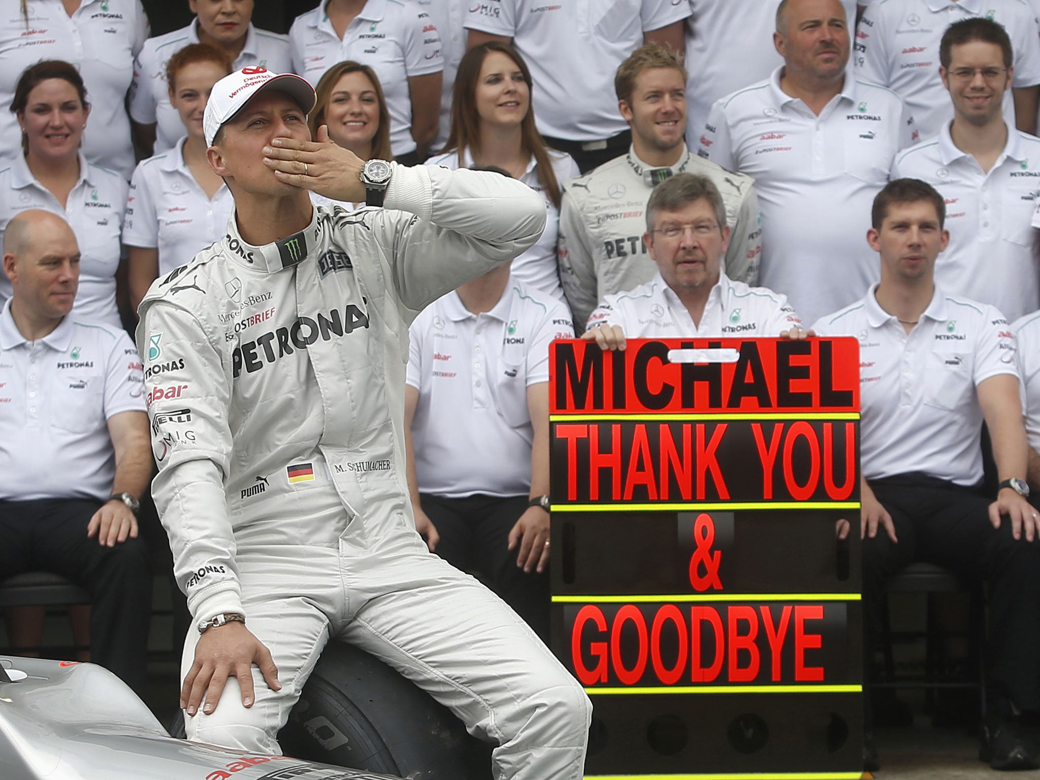 Mercedes Formula One driver Schumacher gestures during a photo call before the Brazilian F1 Grand Prix at Interlagos