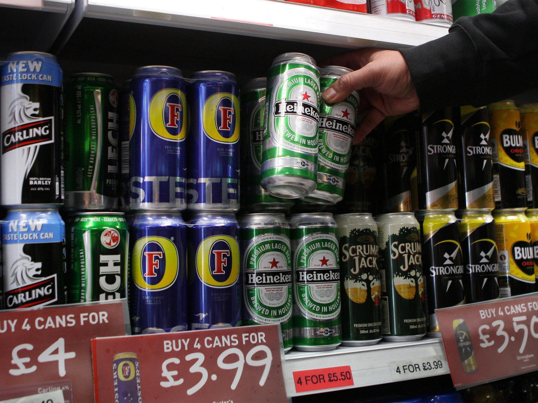 Cans of lager on supermarket shelf