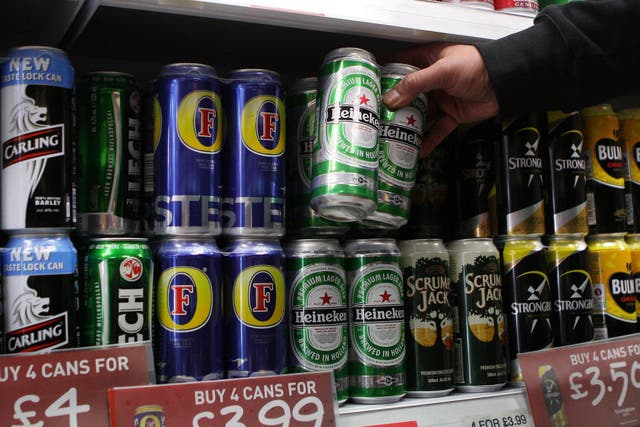 Cans of lager on supermarket shelf