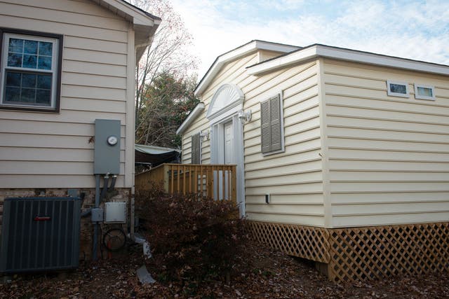 GRANNYPOD: A MedCottage is shown behind a home in Alexandria, Virginia. The small, high-tech cottages function like portable hospital rooms, and they're designed to allow a family to look after an aging or disabled loved one on their property.
