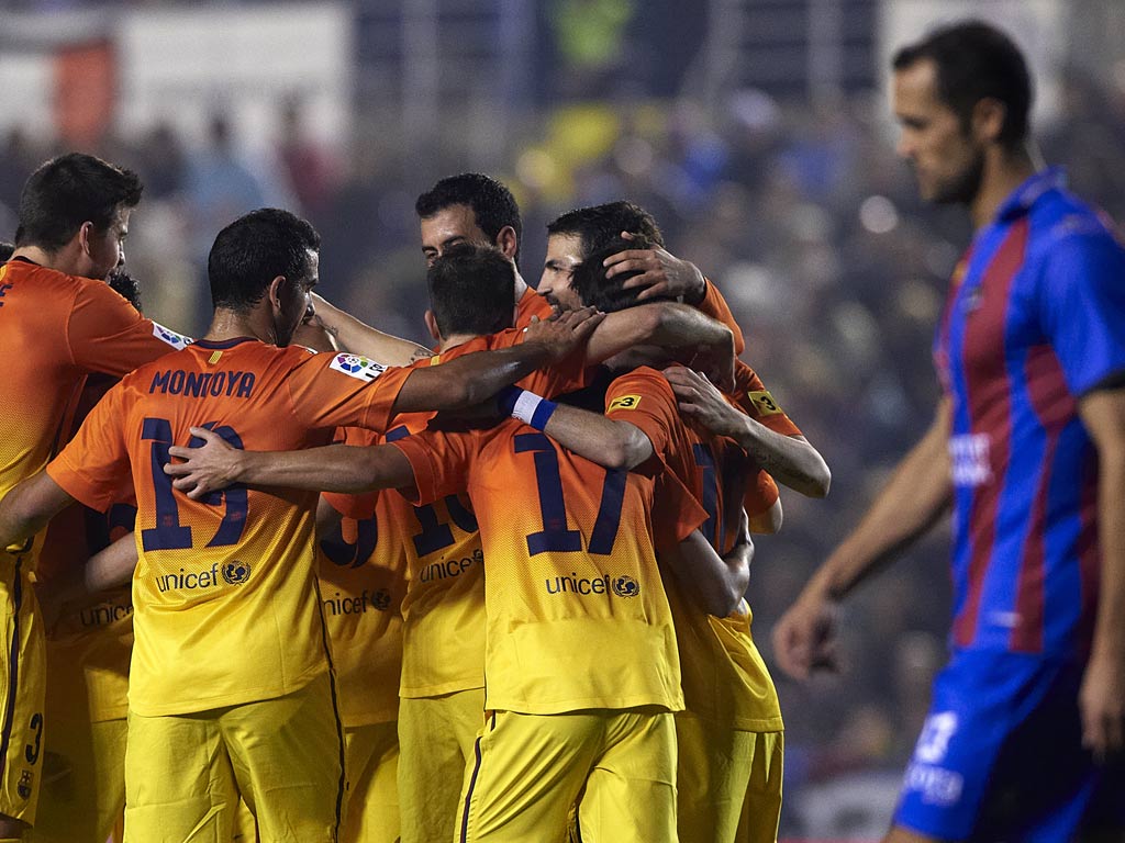 Andres Iniesta of Barcelona celebrates scoring the third goal with his teammates during the la Liga match between Levante UD and FC Barcelona