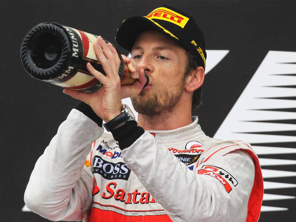 Jenson Button celebrates victory in Brazil