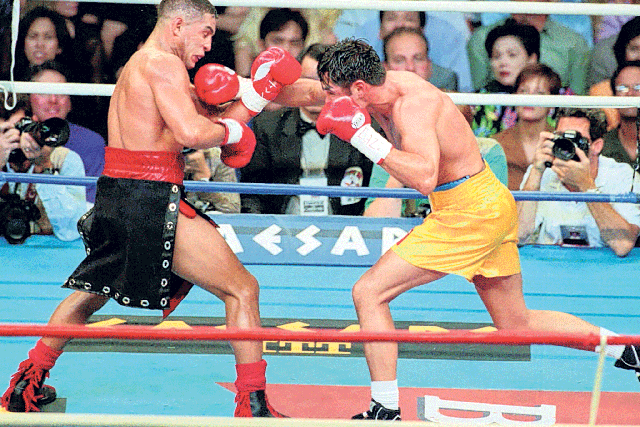 Camacho, above left, fights Oscar De La Hoya in 1997