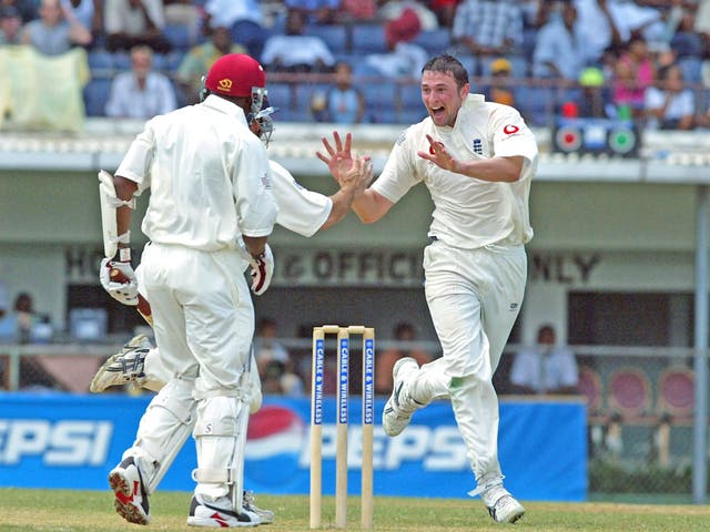 Steve Harmison of England celebrates taking the wicket