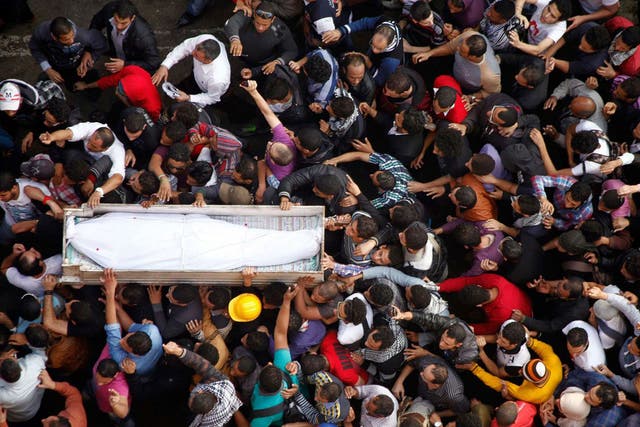 Mourners carry the coffin of Gaber Salah, an activist who died in clashes at Cairo’s Tahrir Square last week, at his funeral