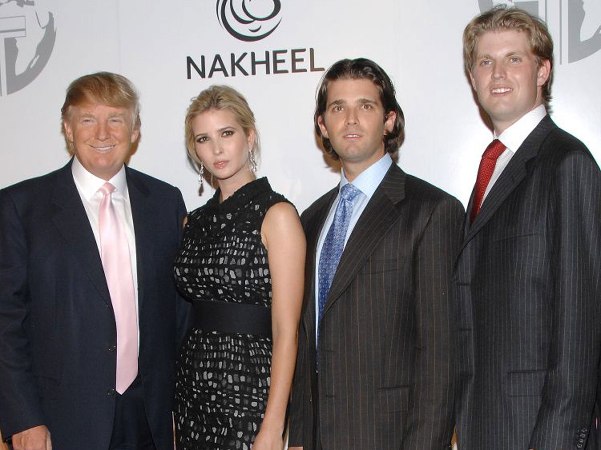 Donald Trump with his children Ivanka, Donald Jnr and Eric at one of his business launches