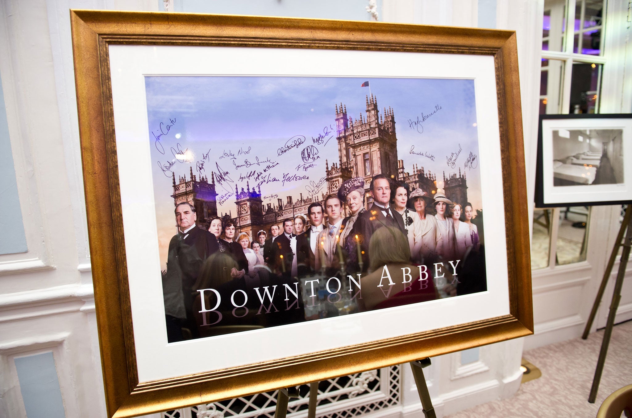 A signed and framed poster of Downton Abbey awaits auction during 'An Evening With Downton Abbey - Raising Money For Merlin - The Medical Relief Charity' at The Savoy Hotel on July 14, 2011 in London, United Kingdom.