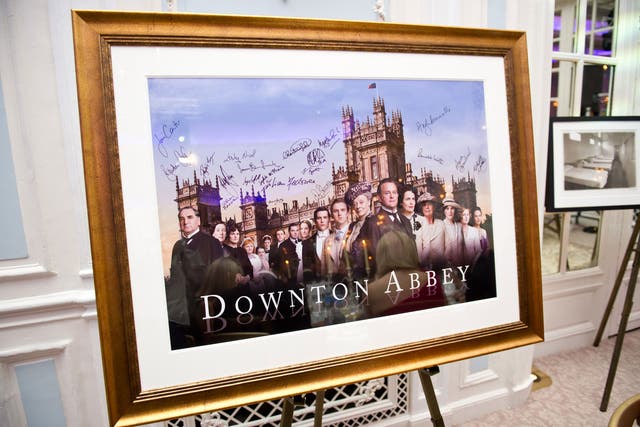 A signed and framed poster of Downton Abbey awaits auction during 'An Evening With Downton Abbey - Raising Money For Merlin - The Medical Relief Charity' at The Savoy Hotel on July 14, 2011 in London, United Kingdom.