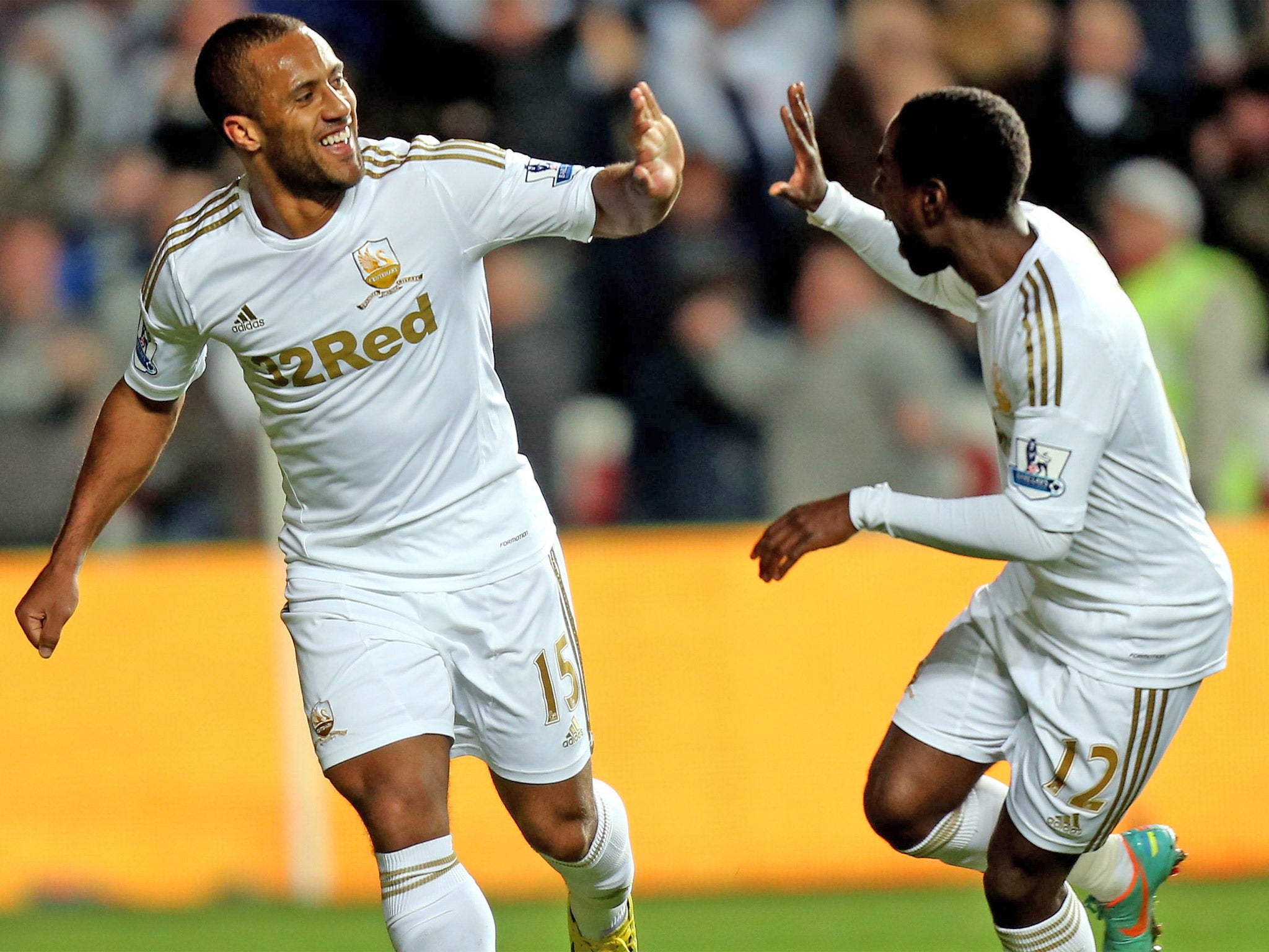 Wayne Routledge, left, struck twice in the first half