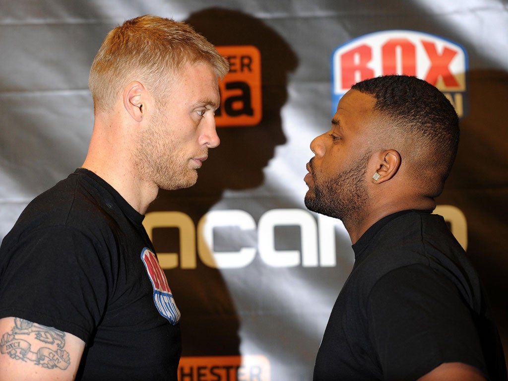 Andrew Flintoff squares up to Richard Dawson at yesterday’s weigh-in