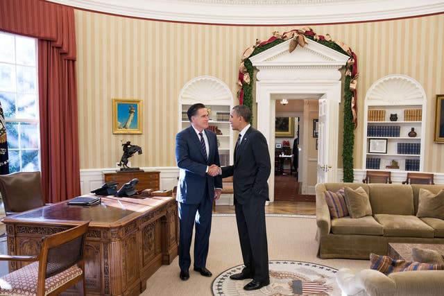Former Massachusetts governor Mitt Romney shakes hands with President Barack Obama in the Oval Office before lunch Thursday at the White House. The White House reported that Romney congratulated Obama on his victory and wished him well. 

