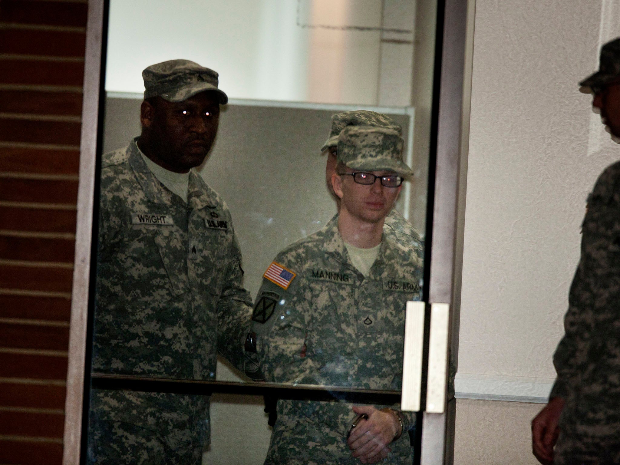 Pfc. Bradley Manning is brought into the court