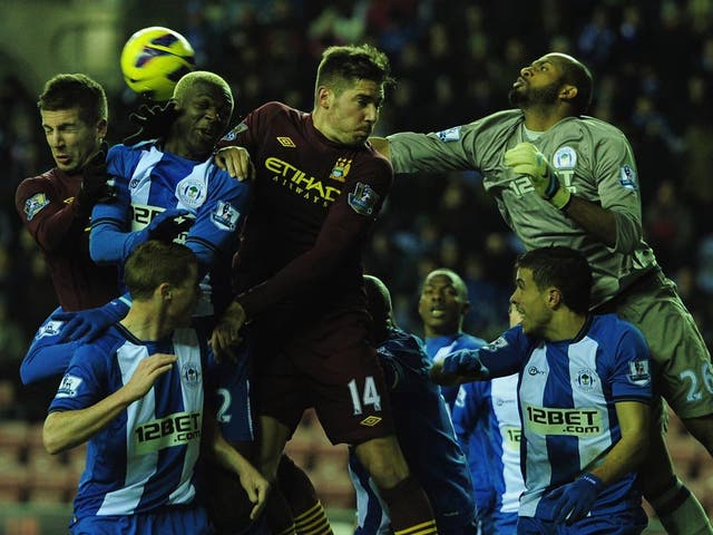 Ali Al Habsi in action against Manchester City