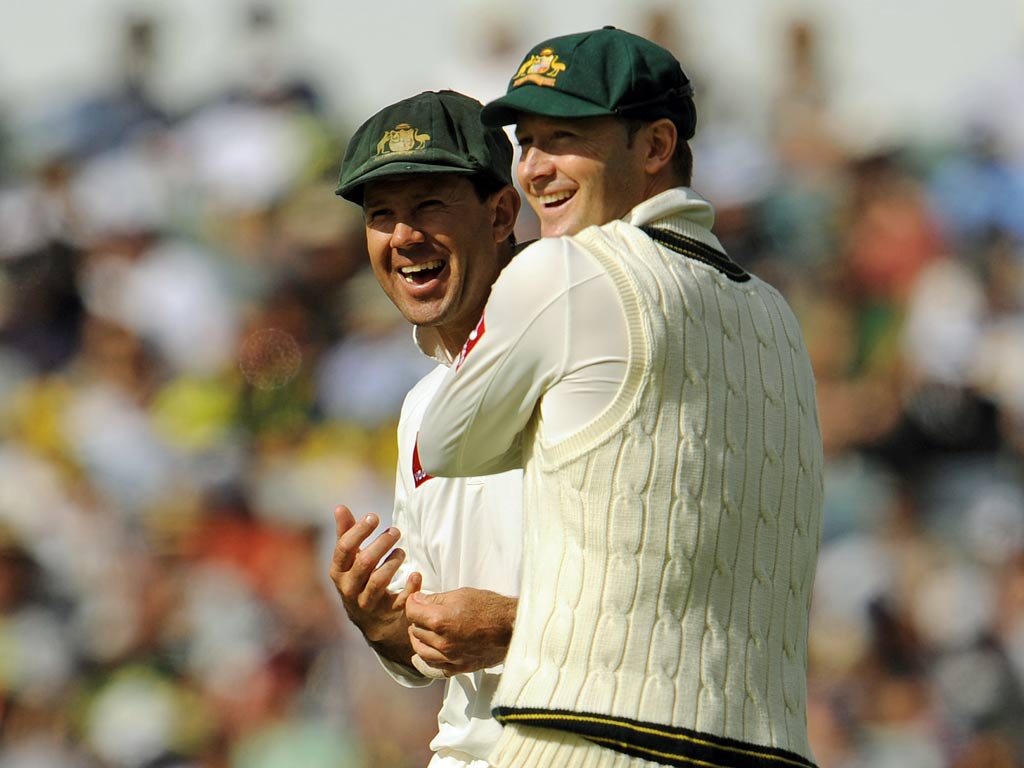 Australian Test cricket captain Michael Clarke (R) shares a joke with teammate Ricky Ponting
