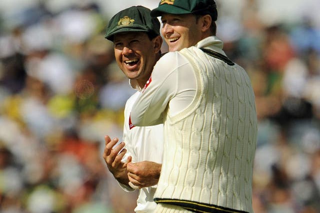 Australian Test cricket captain Michael Clarke (R) shares a joke with teammate Ricky Ponting 