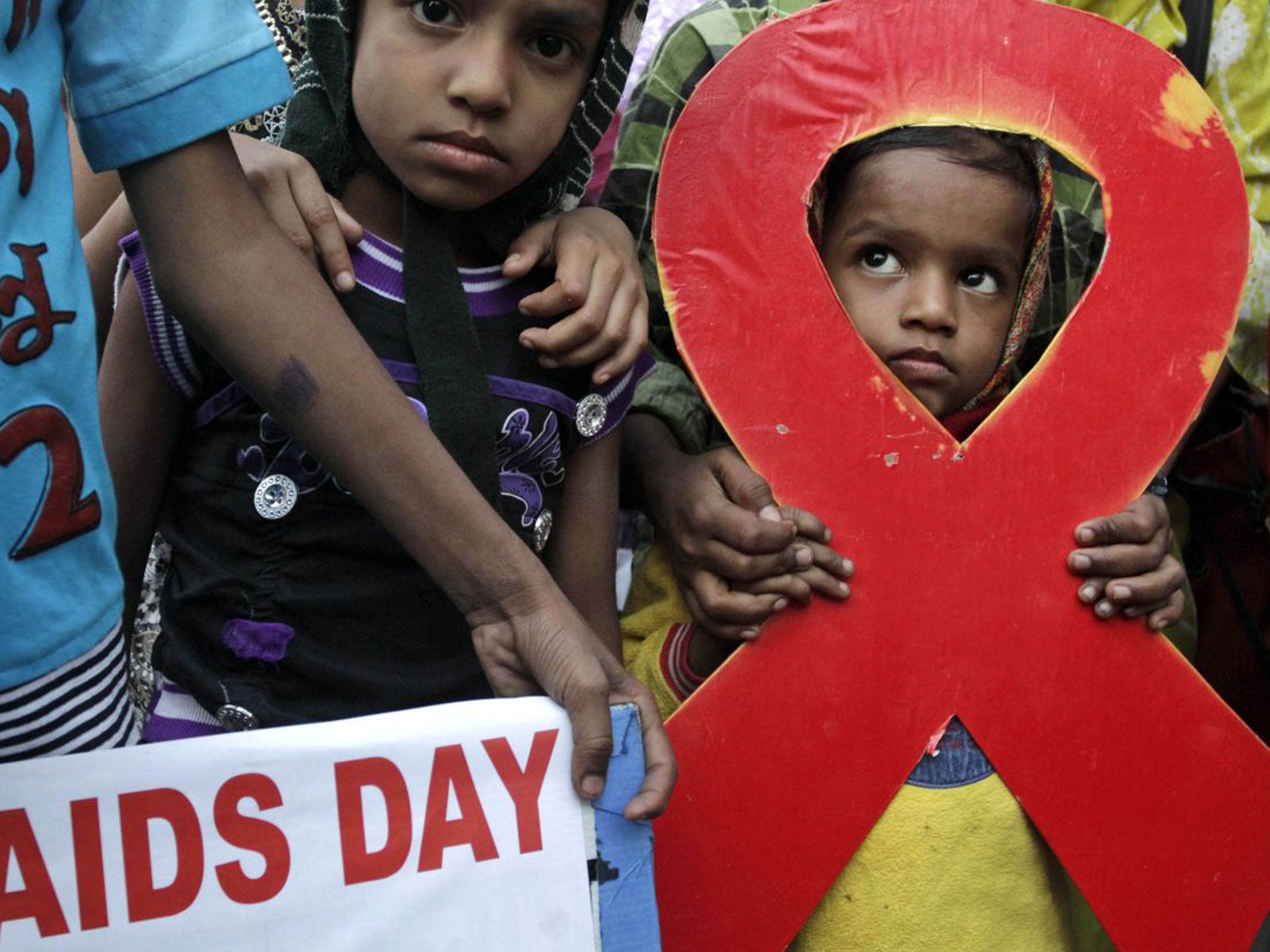 A torch light rally is held in Kolkata yesterday ahead of World Aids Day
