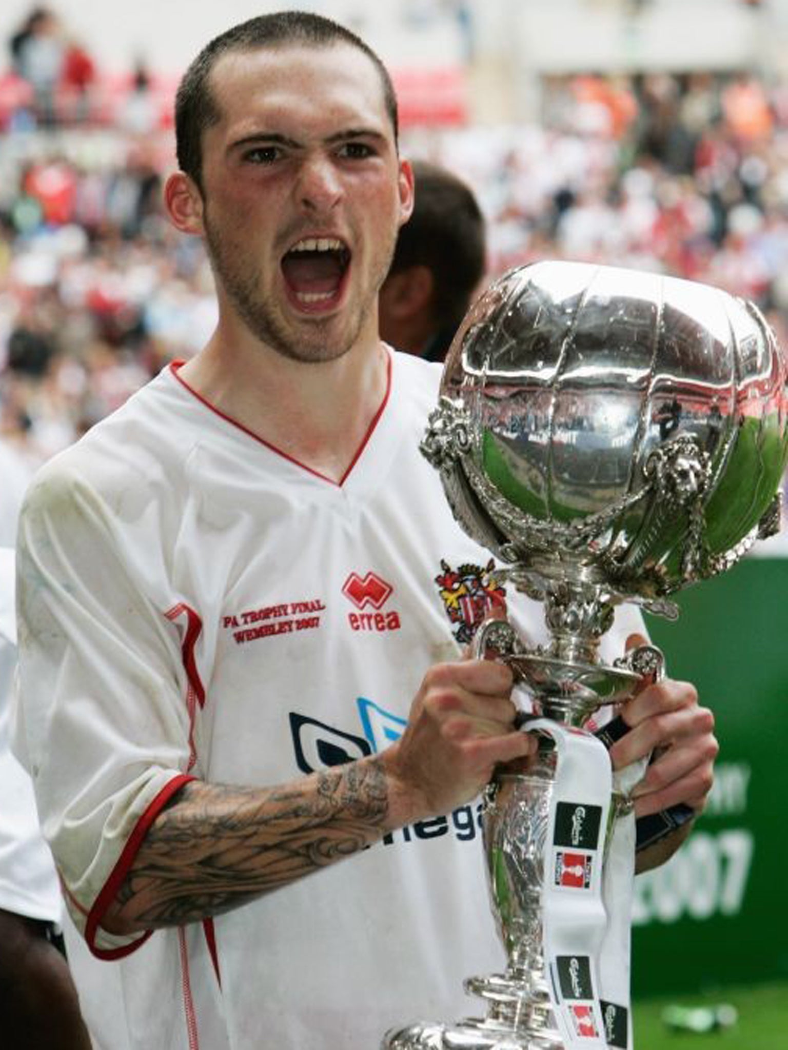 Cole celebrates with the trophy following the FA Trophy Final match between Kidderminster Harriers and Stevenage Borough at Wembley in 2007