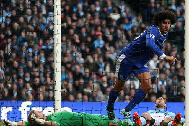 Maraoune Fellaini celebrates after scoring his goal against Manchester City