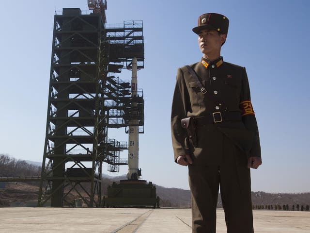 On guard: A North Korean soldier at the Unha 3 rocket site in April