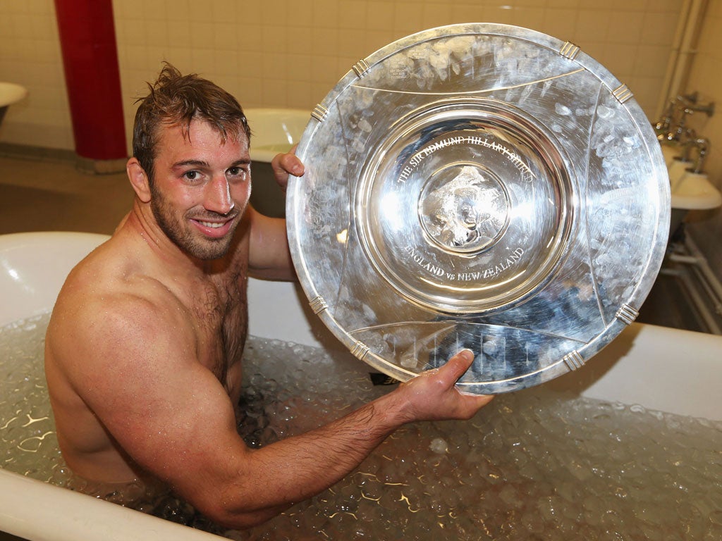 Glittering prize: Chris Robshaw displays the fruits of his side's labour in giving the All Blacks a cold bath