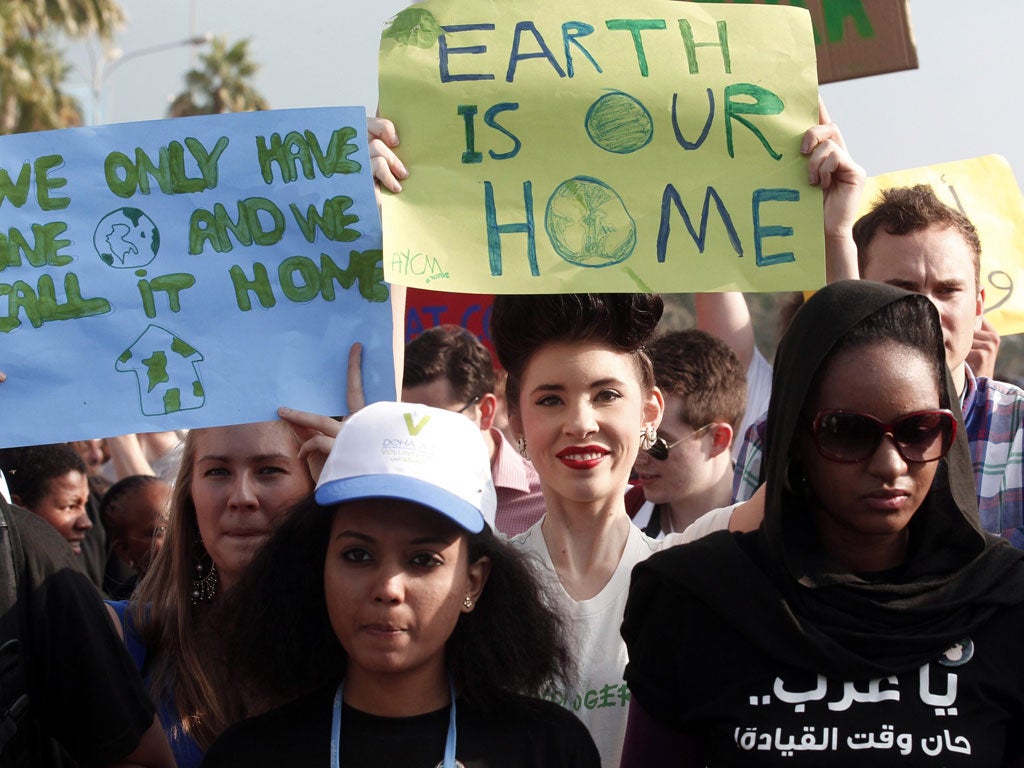 Protestors demand action to address climate change in Doha yesterday