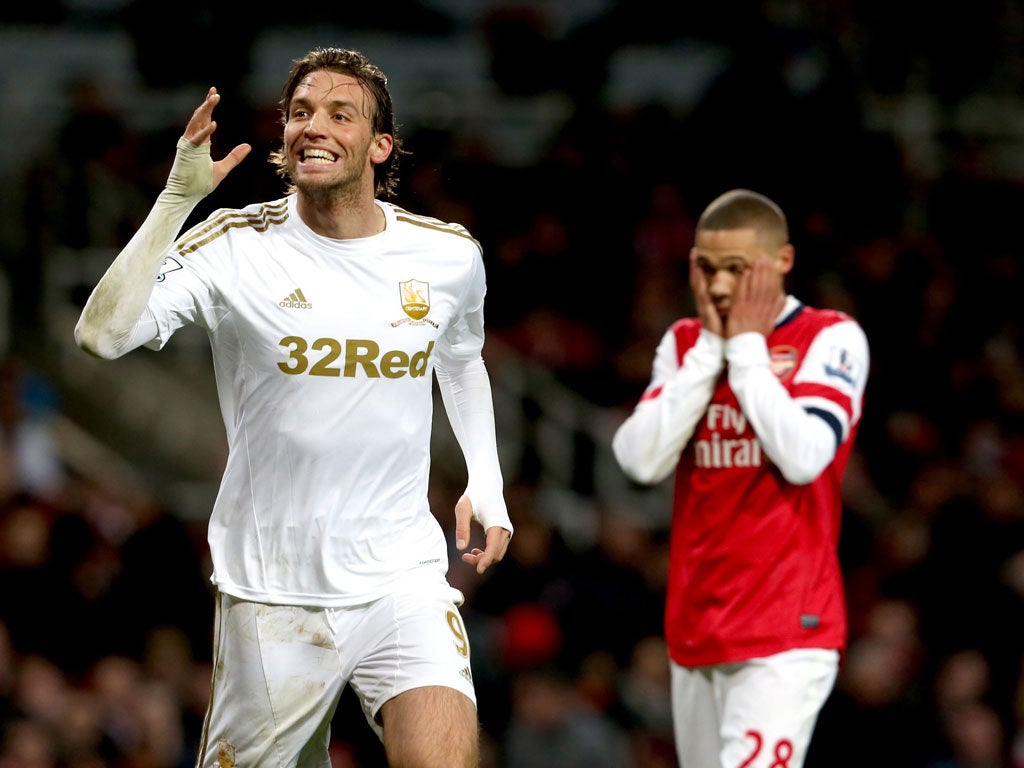 Kieran Gibbs holds head in hands as Swansea’s Michu enjoys giving his side victory