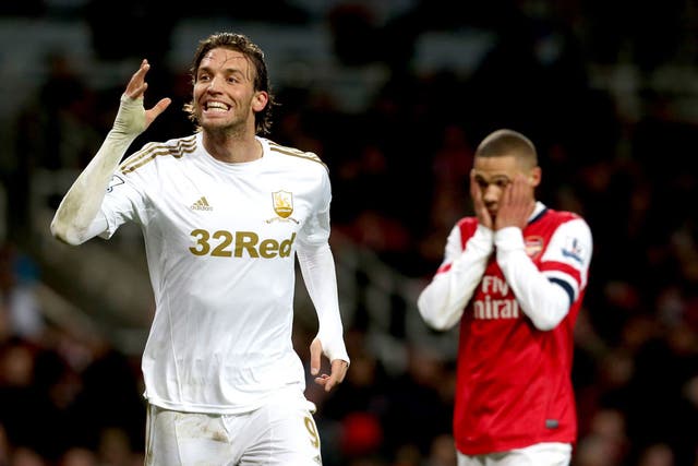 Kieran Gibbs holds head in hands as Swansea’s Michu enjoys giving his side victory