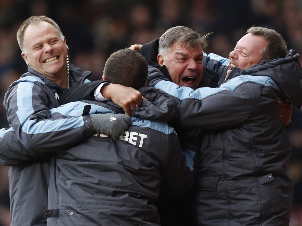 Sam Allardyce (second right) celebrates West Ham’s third goal