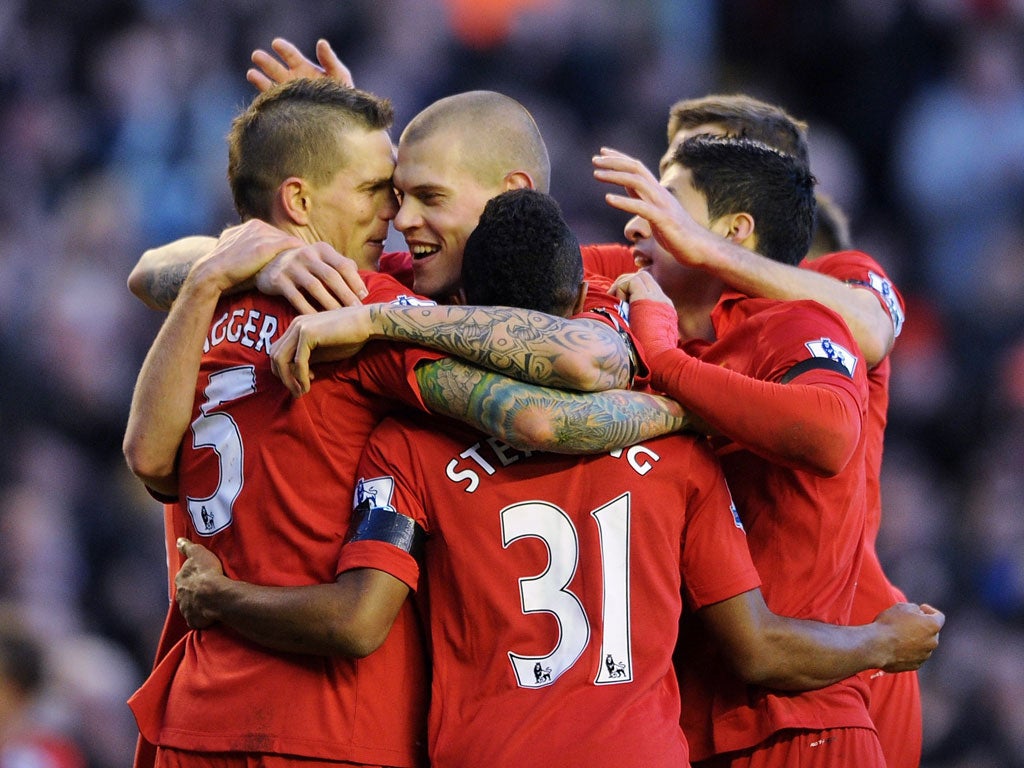Daniel Agger (left) is congratulated for scoring Liverpool’s winner