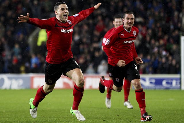 Craig Conway (left), of Cardiff, celebrates after scoring the winner