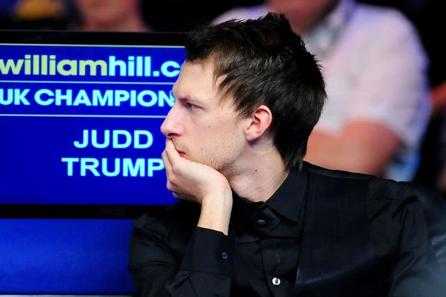 Judd Trump ponders his shock defeat in the UK Championship